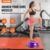 A woman is exercising on a balance ball trainer in a gym. Produktbild-Vorschau
