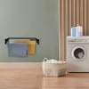 A laundry room scene with a wall-mounted drying rack, a washing machine, and a laundry basket. Voir les images du produit