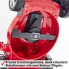 Close-up view of the underside of a red lawnmower, focusing on the cutting blade and motor housing. Produktbild-Vorschau