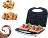 A collage of images showing a waffle maker with waffles, strawberries, raspberries, mint, and chocolate sauce. Anteprima dell’immagine prodotto