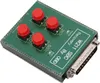 A green circuit board with four red buttons and a silver connector. Voir les images du produit