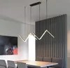 A modern dining room with a sleek LED pendant light hanging over a wooden table. Produktbild-Vorschau