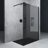 A modern walk-in shower with black glass and a concrete wall. Produktbild-Vorschau