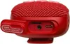A close-up view of the ports and a strap on a red portable Bluetooth speaker. Voir les images du produit