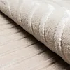 Nowoczesny dywan z motywem kokardy w kolorze beżowym Podgląd zdjęcia produktu 4