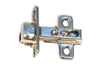 A close-up studio shot of a cabinet hinge on a white background. Produktbild-Vorschau