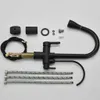 A black kitchen faucet and its accessories are laid out on a white background. Náhľad obrázku produktu
