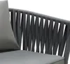 A close-up view of the woven back and seat cushion of a gray outdoor chair. Náhled obrázku produktu