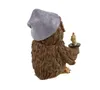 A figurine of an owl wearing a nightcap and holding a candle. Produktbild-Vorschau