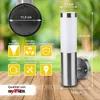 A Grafner stainless steel wall lamp is displayed on a wooden surface with a blurred green background. Various icons and text highlight the product's features and specifications. Produktbild-Vorschau