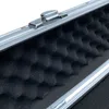 Close-up view of the interior of an aluminum case with foam padding and a latch. Produktbild-Vorschau
