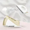 A steam iron and its base are shown against a white, wrinkled fabric background. Produktbild-Vorschau