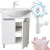A white bathroom vanity with a ceramic sink and chrome faucet, along with plumbing parts and a smiley face made of soap bubbles. Anteprima dell’immagine prodotto