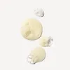 Several blobs of liquid, some with bubbles, on a white background. Anteprima dell’immagine prodotto
