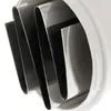 A close-up view of the interior of a white kitchen gadget with dark, wavy blades. Náhled obrázku produktu