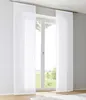 Two white sheer panel curtains hanging in front of a window with a view of greenery. Produktbild-Vorschau