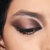 A close-up of a woman's eye with makeup. Produktbild-Vorschau