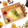 A cheese board with various snacks and cheese. Náhľad obrázku produktu