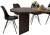 A dark brown oval dining table with black chairs around it, set against a white background. There are some decorative items on the table. Produktbild-Vorschau