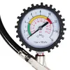 A close-up of a tire pressure gauge with a hose attached. Produktbild-Vorschau