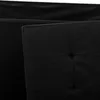 A close-up view of a black upholstered surface with tufted detailing. Náhled obrázku produktu