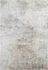 A close-up, top-down view of a rug with a distressed, abstract pattern. Produktbild-Vorschau