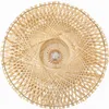 A top-down view of a round, woven bamboo lamp shade with a spiral pattern. Anteprima dell’immagine prodotto