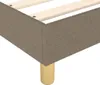 A close-up view of the corner of a taupe fabric bed frame with wooden legs. Produktbild-Vorschau