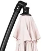 Close-up of the top mechanism and folded fabric of a patio umbrella. Anteprima dell’immagine prodotto