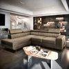 A luxurious and modern living room with a large sectional sofa and a spiral staircase in the background. Produktbild-Vorschau