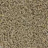 A close-up, overhead view of a pile of small, cylindrical animal feed pellets. Podgląd zdjęcia produktu