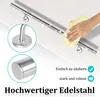 A hand is shown cleaning a stainless steel handrail with a yellow cloth, with close-up insets of the mounting bracket and the end cap of the handrail. Náhled obrázku produktu