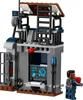 A LEGO Jurassic World Dilophosaurus attack set with a small building and a minifigure. Produktbild-Vorschau