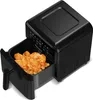A black air fryer with its basket pulled out, filled with cooked chicken. Produktbild-Vorschau