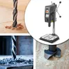 A collage of images showing a drill bit in wood, a drill press, and a different type of drill bit in wood. Produktbild-Vorschau