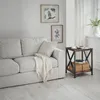 A living room scene with a sofa and a side table. Voir les images du produit