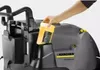 A person is inserting a yellow bottle of cleaning solution into a Karcher pressure washer. Anteprima dell’immagine prodotto