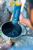 A person is using a water filter to fill a pot. Produktbild-Vorschau