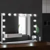 A Hollywood-style vanity mirror with LED lights is displayed on a wooden surface against a dark gray wall. Anteprima dell’immagine prodotto