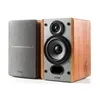 A pair of Edifier P12 passive bookshelf speakers are shown against a white background. One speaker is in the foreground, showing its front panel with a tweeter, woofer, and bass reflex port. The other speaker is positioned to the left, with its fabric gril Produktbild-Vorschau