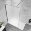 A modern bathroom shower enclosure with a frosted glass panel and a silver support bar. Produktbild-Vorschau