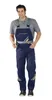 A man wearing navy blue overalls with yellow and gray accents, standing against a white background. Produktbild-Vorschau