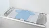 A blue t-shirt is laid out on a mesh drying rack that is placed across a bathtub. Anteprima dell’immagine prodotto