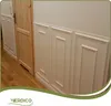 A hallway with a wooden door and white wall panels. Podgląd zdjęcia produktu