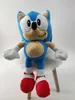 A plush toy of Sonic the Hedgehog sitting on a white fluffy stool. Produktbild-Vorschau