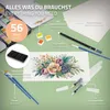 A flat lay of a watercolor paint set with various components arranged around a watercolor painting of flowers. Podgląd zdjęcia produktu
