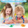 Two young children are drawing at a table, with colorful drawings and toys around them. Produktbild-Vorschau
