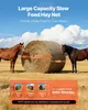 Two horses standing in a field next to a large round bale of hay covered in a net. Anteprima dell’immagine prodotto