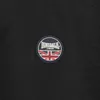 A close-up of a black fabric with a circular Lonsdale logo featuring the Union Jack flag. Produktbild-Vorschau