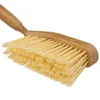 A close-up shot of a broom head and handle. Produktbild-Vorschau